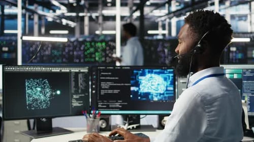 Data Center Employee Talking in Headset Mic Coordinating Technicians