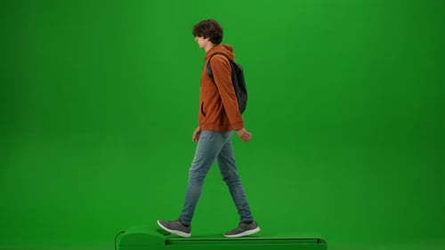 Portrait of Traveler Isolated on Chroma Key Green Screen Background Young Man Walking with Backpack