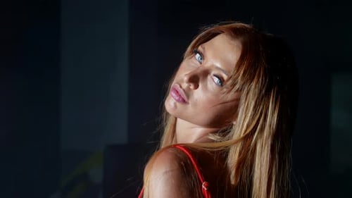 Attractive Woman with Blonde Hair Posing in Red Dress