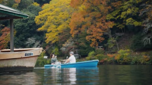 Tourists Rowing Boats in a Japanese Autumn Park