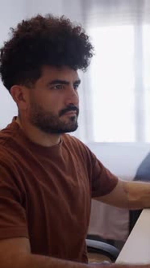 Handsome Venezuelan Guy Working From Home in Spain