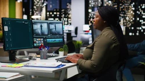 Professional Video Editing Team Works on Film Montage on Software in Office