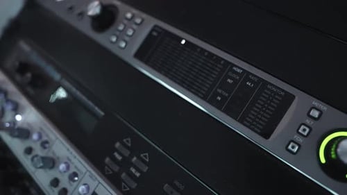 A Detailed View of Faders and Control Knobs on an Audio Mixing Console