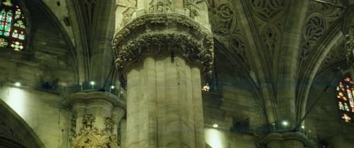 Ornate Cathedral Interior with Columns and Stained Glass