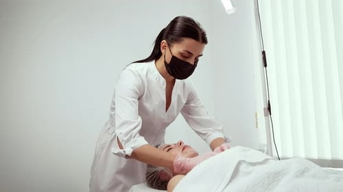 Professional Beautician Cleansing Face During Skincare Treatment Improving Texture Specialist Gently