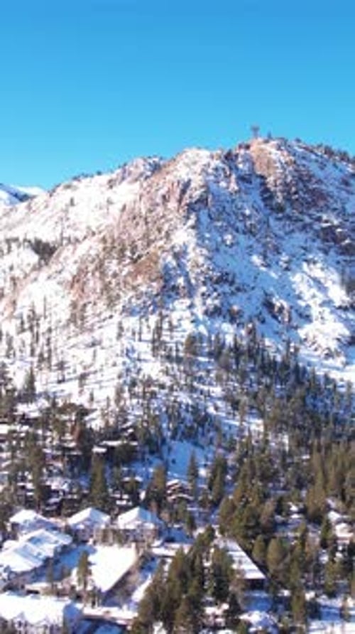 Vertical Aerial View, Snow Capped Hills Above Olympic Village and Palisades Ski Resort, Lake Tahoe