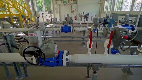 Complex indoor pipeline system with valves, meters and control gauges in bright facility