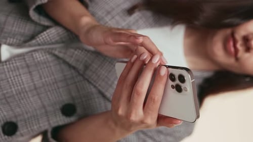 Woman Using Modern Cellphone in Portrait Orientation