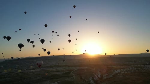 Aerial View of Hot Air Balloons at Sunrise