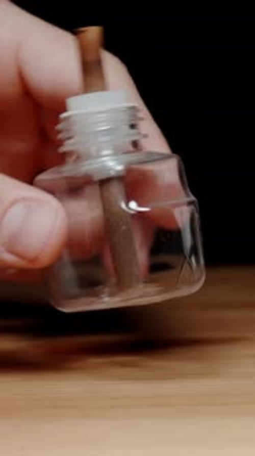 Air Freshener Container Being Checked Close Up