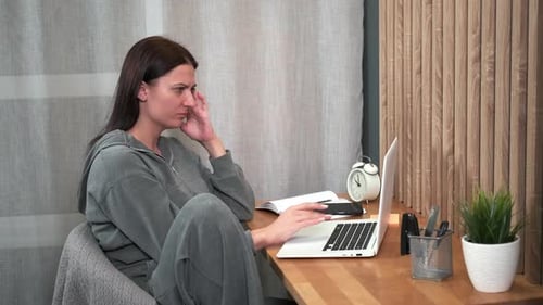 Woman at Computer with Headache