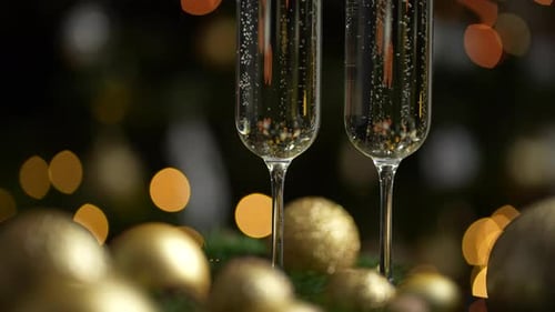 Champagne flutes and gold ornaments for New Year's