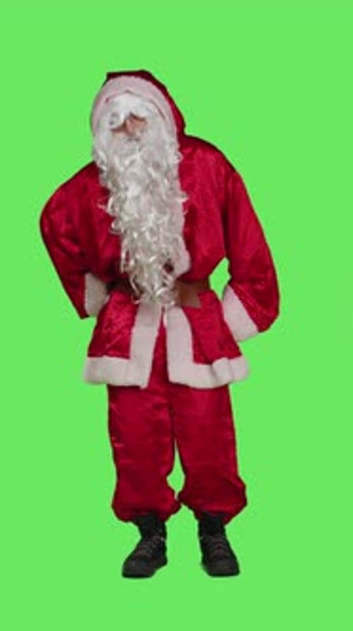 Vertical Video Front View of Santa Suffers From Back Pain in Studio