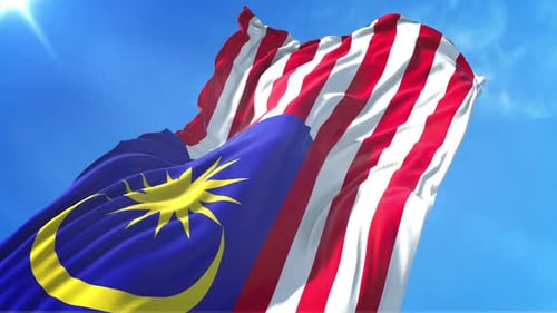 Realistic Waving Flag of Malaysia Against Blue Sky
