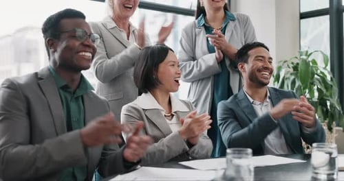 Smiling Business Team Clapping in Modern Office