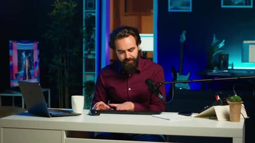 Man Filming Video for Online Channel Presenting Mouse and Keyboard