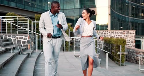 Business Professionals Joyfully Skipping, High Fiving in City