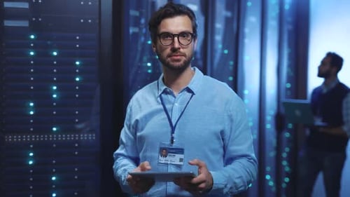 IT Professional Holding Tablet in Data Center
