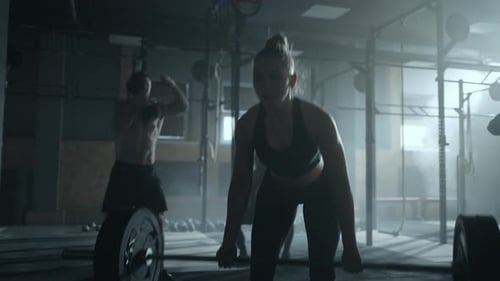 Deadlift in Old Gym Beautiful Sportive Woman Lifting Barbell in Dark Fitness Club Epic Endurance