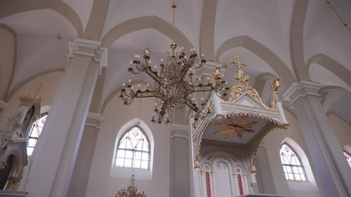 Majestic Interior of Ornate European Church with Chandeliers and Vaulted Ceilings