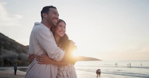 Couple, beach and hug with love on holiday in nature and sightseeing for bonding together by sunset