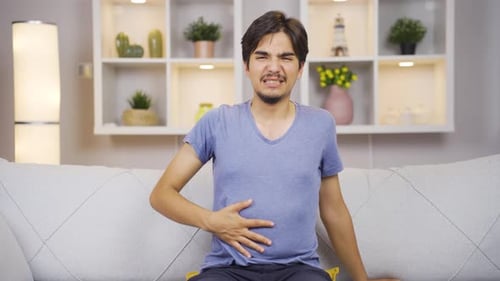 Man experiencing stomachache.