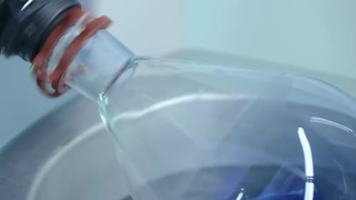 Blue Liquid Mixing in a Glass Beaker