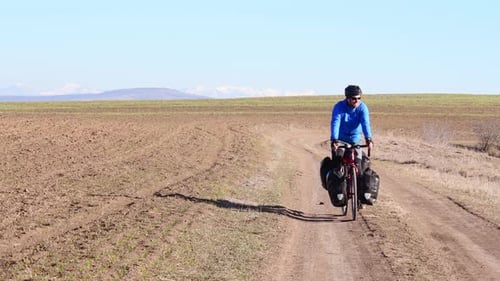 Male Cyclist Ride Bicycle On Highlands In Asia