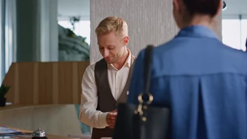 Hotel Concierge Assisting Clients on Arrival Closeup Smiling Professional Work