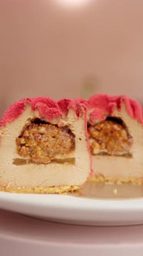 Delicious Dessert Cut in Half on Plate Indoors