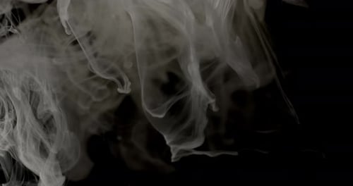 Fading White Smoke Trails In Dark Background