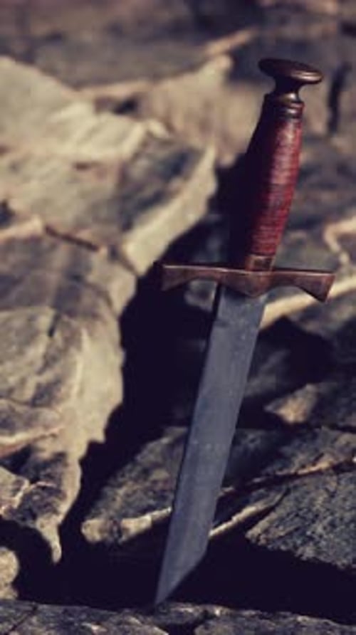 Excalibur Sword in Rocky Stone at Sunset
