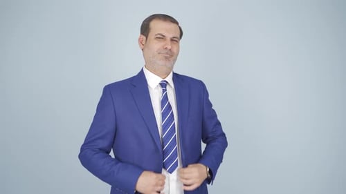 Smiling Man in Blue Suit Poses Confidently