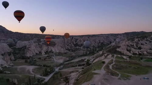 Hot Air Balloons Over Cappadocia Landscape at Sunrise