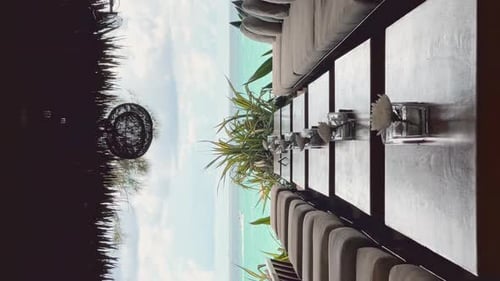 Few Tables in Row in Restaurant on a Beach Club at Sunny Day Lounge Chairs Sofas