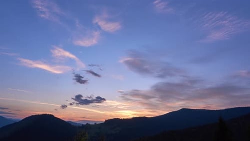 Colorful Clouds at Dusk at Golden Hour Blue Sky and Silhouette of Mountain Forest Landscape