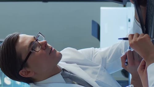 Professional Medical Doctors Working in Hospital Office Making Computer Research Medicine Healthcare