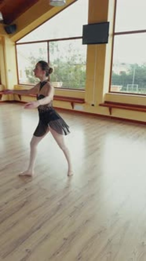 Ballet Dancer Practicing in Sunny Dance Studio