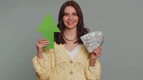 Woman Holding Arrow and Cash Smiling