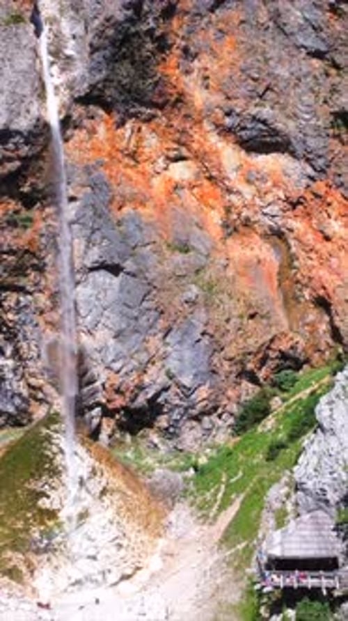 Rinka Waterfall Plunging Into Logarska Dolina Valley in Slovenia During Summer