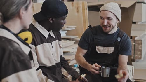 Factory Worker Chatting with Colleagues on Lunch Break