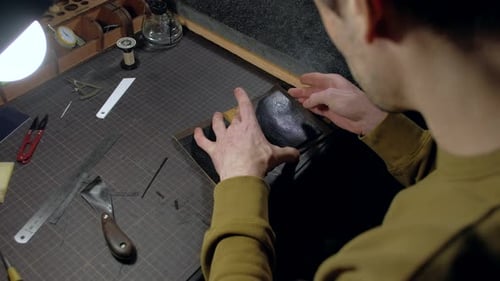 Person Tailor Who Works with Leather in Workplace