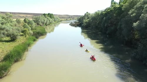 Aerial View Of Group Of People Canoeing On The River 3