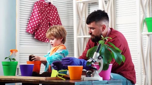 Father Ans Son Planting Flowers Little Helper in Home Garden Farm Family Dad Teaching Little Son