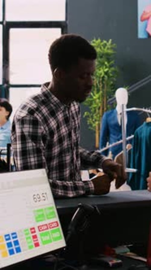 Customer Paying with Card in Clothing Store