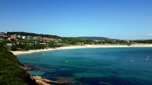 Drone Reveal Footage of Impressive Beach and People Swimming on Clear Water