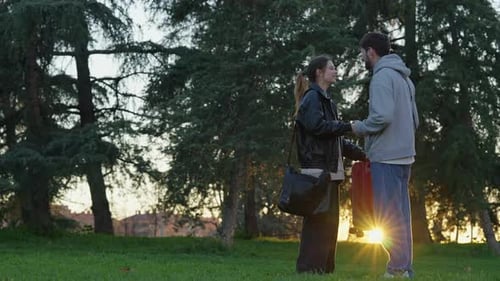 Young Couple Parting Ways in Beautiful Sunset Park