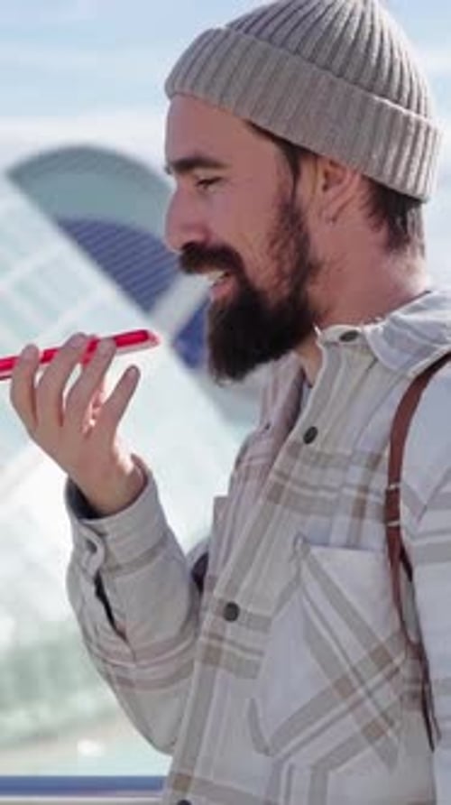 Young Man Uses Voice-to-Text on Smartphone