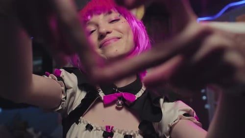 Smiling Young Woman with Pink Hair Posing