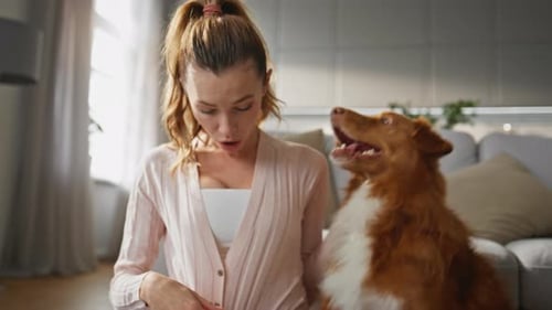 Woman Having Fun Dog Spending Time Together at Home Close Up Girl Caressing Pet
